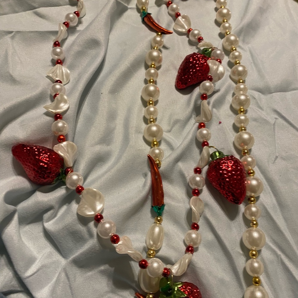 Mardi Gras beads throws red peppers chilis or strawberry beads n pearls